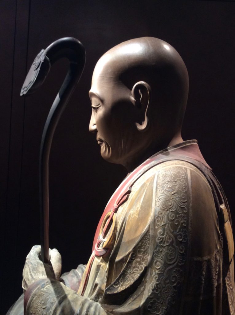 Figure of an elderly Buddhist at Phoenix Ancient Art during Asia Week NY